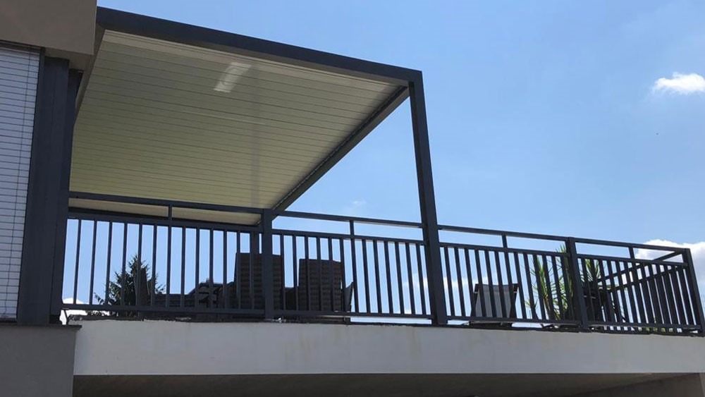 a pergola covering a part of the balcony in austria